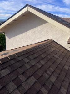 High-angle view of a newly installed grey composition shingle roof on a residential home in Vacaville.