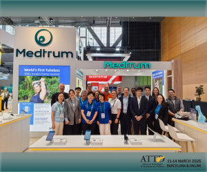 A group of Medtrum employees smiling at the ATTD 2026 conference booth, representing the innovators behind the TouchCare Nano AID System