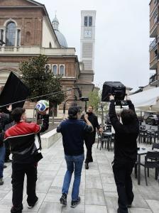 ORBIS Production crew filming on location in Milan, Italy, during a high-end international production shoot.