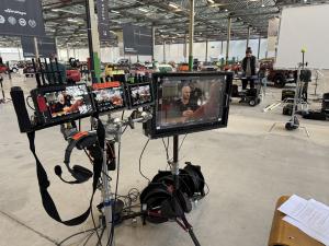 Professional camera monitors and filming equipment on an ORBIS Production set during an international studio shoot.