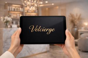 Tablet displaying Velcierge AI concierge system used by salons, aesthetic clinics, and service businesses to manage bookings and client communication.