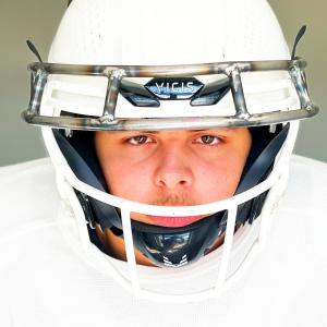 16 year-old Marist Veres Royal wears his concussion reducing invention: The Halo- Protective Head Mask for Helmets/Headgear (Patent pending).