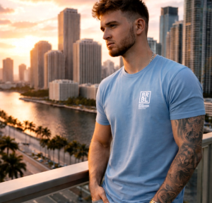 Young man overlooking city skyline at sunset, reflecting during a season of personal growth and change