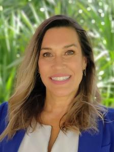 The Reverend Beatrice D'Angelo, Graduate of Emmanuel Lutheran Global Seminary, in a Pastoral Collar and Royal Blue Blazer