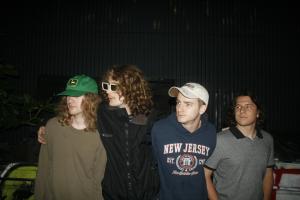 four young men in casual clothes