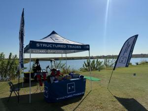 Structured trade tradeshow set-up with custom logo canopy tents by splashtents.com