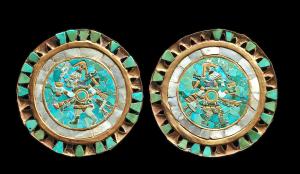 Exquisite pair of Royal Moche ear ornaments with gold frames, circa 100-300 A.D., with colorful tessarae inlays of gold, turquoise, Chilean lapis, nephrite, jadeite and mother-of-pearl. Sold for $82,500