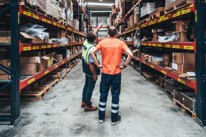 Warehouse staff managing GM and Mopar automotive parts inventory at AEC’s Antwerp facility