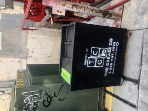 Grease trap inside a commercial kitchen used to capture fats, oils, and grease