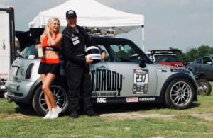 Chris Sneed standing beside the Catdaddy SneedSpeed MINI at Redline Time Attack event 2011