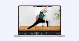 Virtual workplace wellness workshop led by Twello featuring chair yoga session for employees.