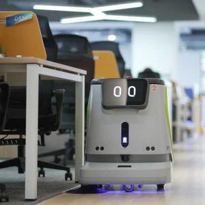 pudu robot cleaning a classroom