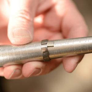 photo of ring being sized on a mandrel