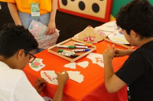Guests at the Taiwan Pavilion enjoyed coloring in and making their own traditional paper douli hats