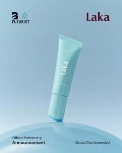 Laka Soothing Prep Lip Mask in a light blue squeeze tube, balanced on a reflective blue sphere for the official B Futurist global distributorship announcement.