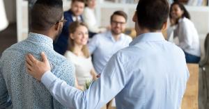Man being introduced to coworking space members
