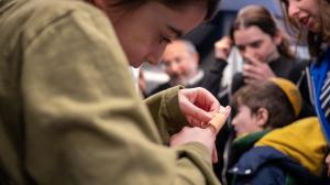 Child tries on band-aid