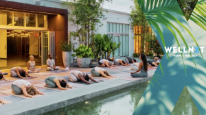 Visual of people doing yoga inside of an outdoor wellness venue