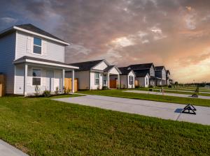 Street view of an Ellison Development residential community in unincorporated Montgomery County Texas