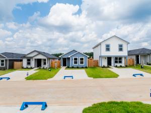 Street view of Castle's Edge residential community developed by Ellison Development in unincorporated Montgomery County Texas