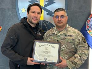 MyProMovers CEO Tursun Alkau and LTC Shawn R. Vergott holding Certificate of Appreciation from Virginia National Guard 91st Cyber Brigade at Fort Belvoir Virginia