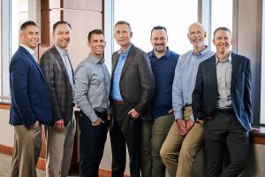 The new 7-person executive team at Lynk Engineers poses for a photo.