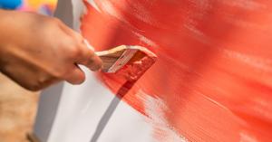 Guest painting on canvas at Cave Craft Art Studio workshop in Bangkok