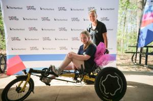 Hailey poses with Olivia in her new bike