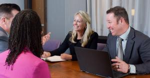 Team members at Northwestern Marketing Concepts engaging in a coaching session focused on leadership development and performance improvement.