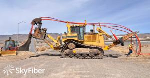 Sky Fiber crew installing underground fiber with trenching equipment in Northern Nevada