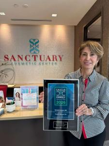 Dr. Soheila Rostami Holding the plaque of Top Doctor 2026 from Castle Connolly