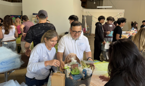 Volunteers come together to pack spring care baskets for families in need