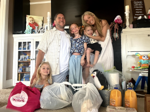 Picture of the family and the basket: The Remuses were one of 420+ families that received the Spring Basket of Miracles, an essential care package delivered to families facing the financial and emotional strain of caring for a critically-ill child.