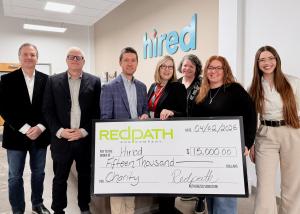 The Redpath and Hired teams pose for a photo at Hired's Minneapolis location