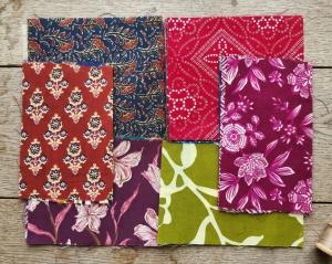 A selection of printed fabric swatches from CTC Jaipur's range, featuring block print, screen print, and Bandhej techniques on cotton cambric and rayon in floral, geometric, and traditional Rajasthani motifs.