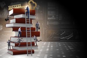 photo os a stack of books with people climbing them with the word success