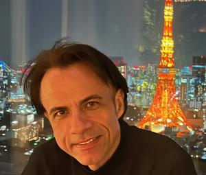 Portrait of Costantino Delli, author and creator of the COS Philosophy, integrating leadership, awareness, and human-centered excellence