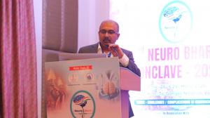 Dr. Mohana Rao Patibandla delivering a neurosurgery lecture on complication avoidance in deep-seated brain lesions at NeuroBharat Conclave 2026 Varanasi