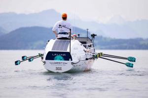 A rower from the 44west team seated on board the vessel