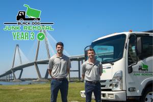 Black Dog Junk Removal team and truck at Arthur Ravenel Jr Bridge in Charleston SC highlighting local junk removal service growth