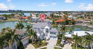 New waterfront Marco Island residence with 5 bedrooms, 5.5 baths, chef’s kitchen, pool and spa, private courtyard, 3-car garage and views of Collier Bay.