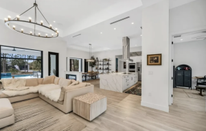 Golden Gate Estates multi-generational estate on 2.6 acres with 5 beds, 4.5 baths, guest house, natural heated pool, and organic food forest with 89+ fruit trees.