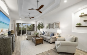 Miromar Lakes renovated south-facing condominium with 3 beds, den, updated flooring and countertops, open-concept layout and extensive resort-style amenities.