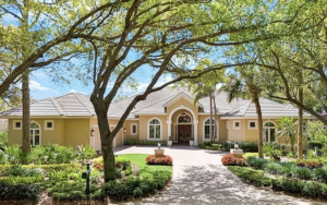 Collier’s Reserve renovated ranch home with 3 beds, den, open-concept layout, resort-style saltwater pool and spa, outdoor kitchen, and golf course views.”