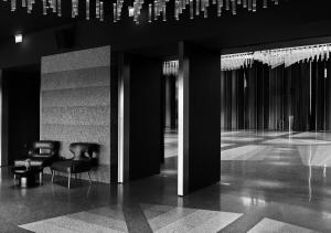 Gray tones of terrazzo on floors and walls of the lobby and ballroom. 