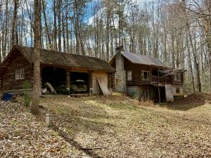 2 BR/1 BA log home w/walk-out basement on 5.01 +/- acres in Spotsylvania County, VA -- Detached 3 bay garage -- Ideal for a rehab project or a well located 5 acre lot for your dream home!! -- Centrally located only 2 miles from Rt. 3, 5.5 miles from I-95