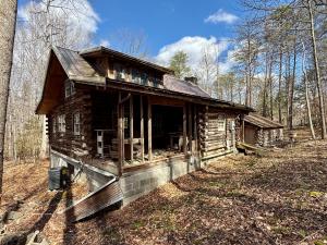 2 BR/1 BA log home w/walk-out basement on 5.01 +/- acres in Spotsylvania County, VA -- Detached 3 bay garage -- Ideal for a rehab project or a well located 5 acre lot for your dream home!! -- Centrally located only 2 miles from Rt. 3, 5.5 miles from I-95