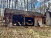 2 BR/1 BA log home w/walk-out basement on 5.01 +/- acres in Spotsylvania County, VA -- Detached 3 bay garage -- Ideal for a rehab project or a well located 5 acre lot for your dream home!! -- Centrally located only 2 miles from Rt. 3, 5.5 miles from I-95