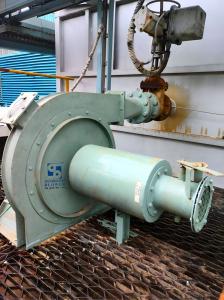 Centrifugal blower connected to ducting with actuator valve in an industrial setup
