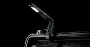 Peli LED work light mounted on a case lid, illuminating the interior against a dark background.